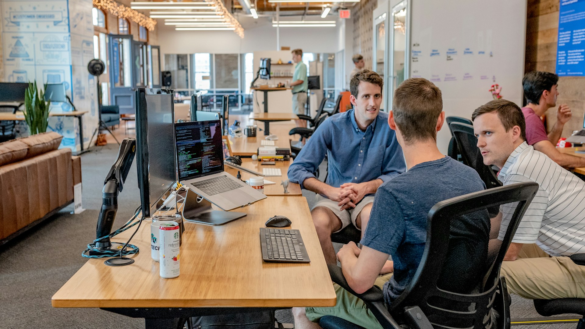 A founder-led startup team reviewing outbound performance metrics together.